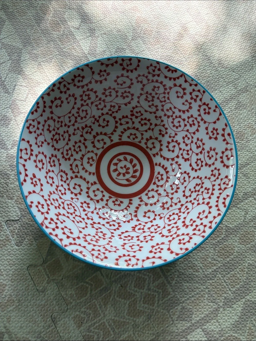Anthropologie White Ceramic Bowl with Red Floral Motif and Turquoise Rim